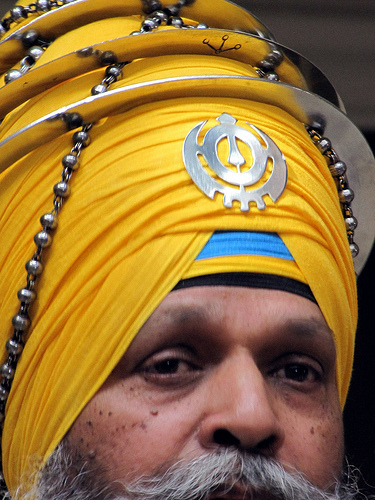 thumbnail to picture of Sikh  man with steel mala on turban